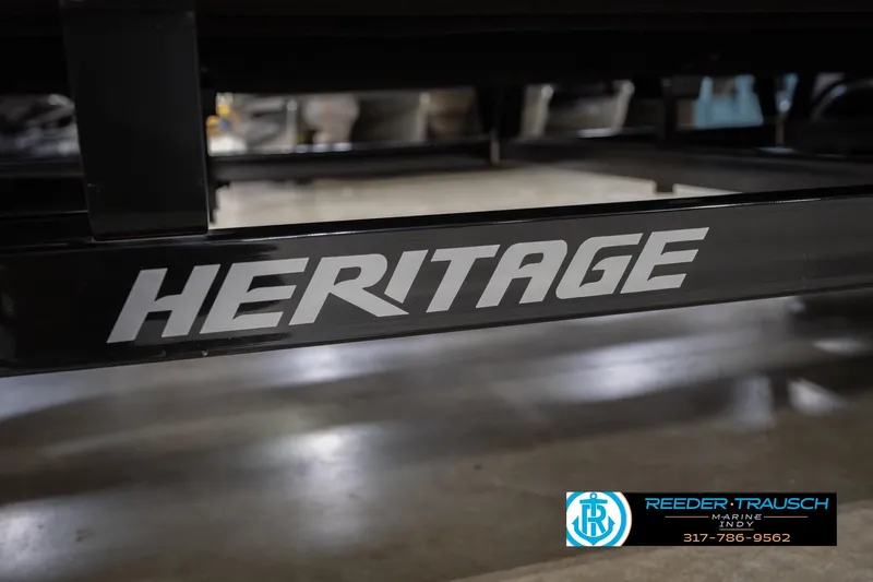 Slide: The Image of 2024 Bennington 23 LSB trailer with "HERITAGE" branding at Reeder Trausch Marine. - 67