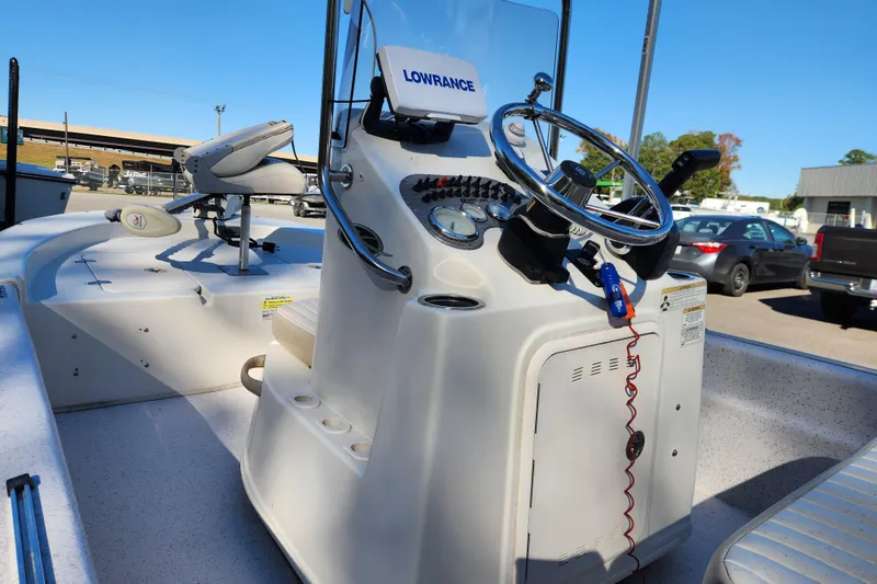 Slide: The Image of 2018 Carolina Skiff 18 JVX CC boat interior with steering console and seating. - 11