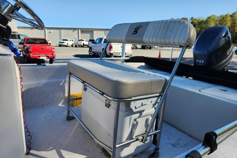 Slide: The Image of 2018 Carolina Skiff 18 JVX CC boat interior with seating and Yamaha outboard motor. - 12