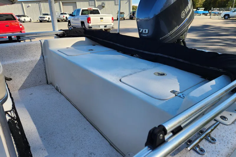 Slide: The Image of 2018 Carolina Skiff 18 JVX CC boat with Yamaha 70 outboard motor, parked outdoors. - 13
