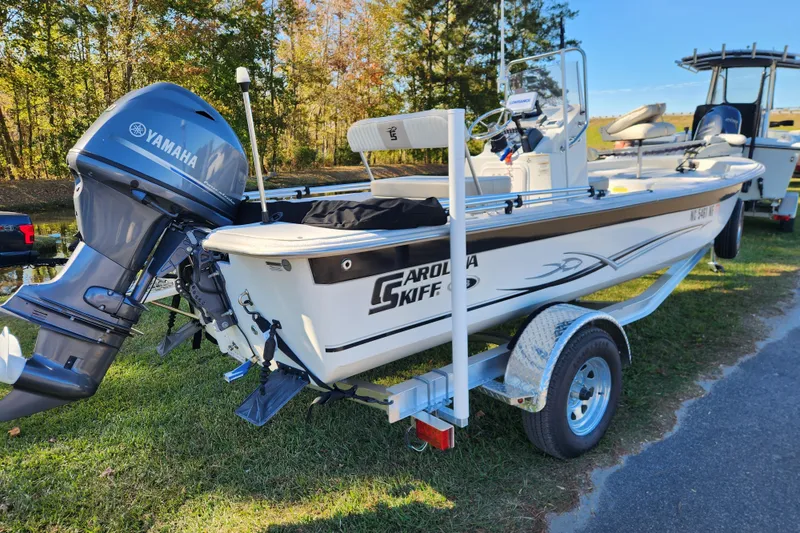Slide: The Image of 2018 Carolina Skiff 18 JVX CC boat with Yamaha outboard motor on trailer. - 2