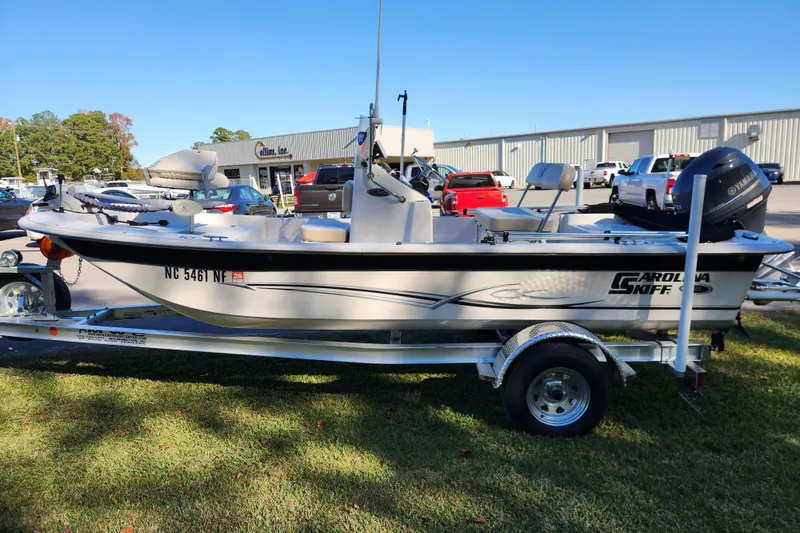 Slide: The Image of 2018 Carolina Skiff 18 JVX CC boat on trailer, parked outdoors. - 5