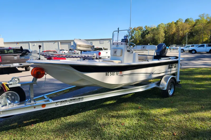 Slide: The Image of 2018 Carolina Skiff 18 JVX CC boat on trailer, parked outdoors. - 6
