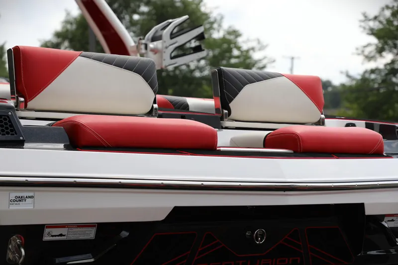 Slide: The Image of 2023 Centurion Fi25 boat with red and white seating, showcasing sleek design. - 11