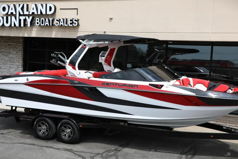 Slide: The Image of 2023 Centurion Fi25 boat in red and white at Oakland County Boat Sales. - 13