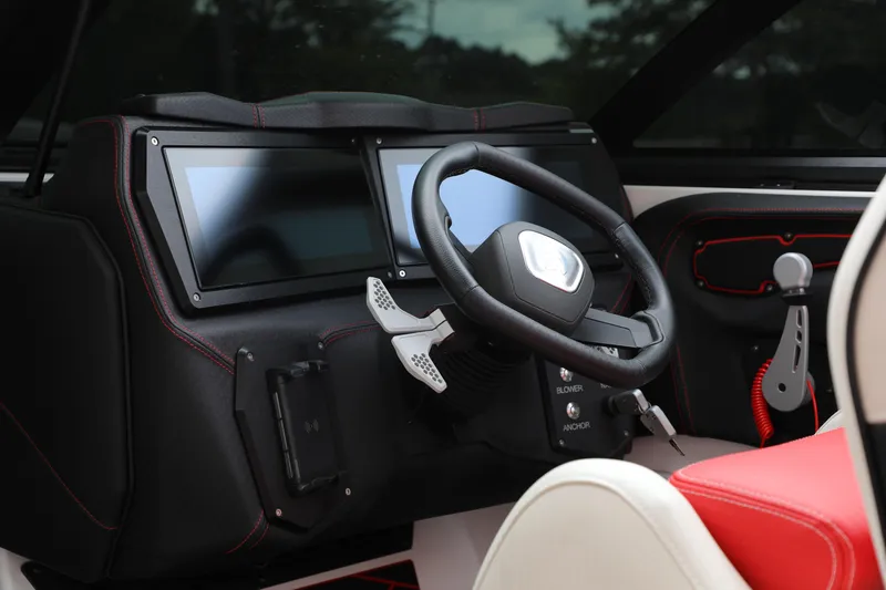 Slide: The Image of 2023 Centurion Fi25 boat dashboard with dual screens and steering wheel. - 3