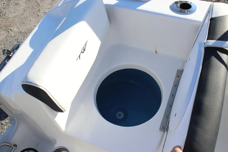 Slide: The Image of 2026 Tidewater 180 CC Adventure boat livewell with cushioned seating. - 25
