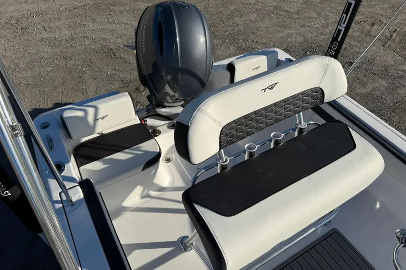 Slide: The Image of 2026 Tidewater 180 CC Adventure boat interior with Yamaha engine, featuring sleek seating and rod holders. - 6
