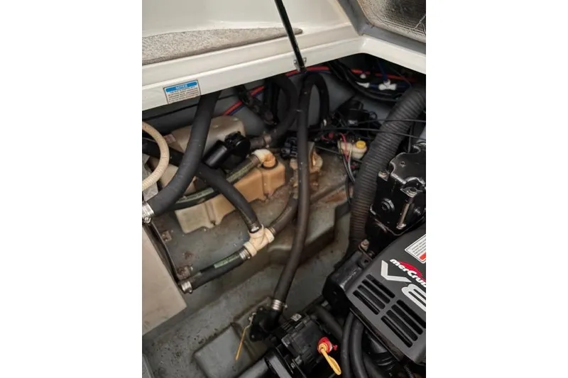 Slide: The Image of Engine compartment of a 1999 Sea Ray 270 Sundancer Special Edition boat. - 22