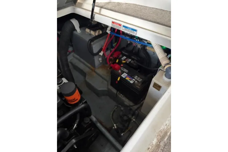 Slide: The Image of Engine compartment of a 1999 Sea Ray 270 Sundancer Special Edition boat. - 23