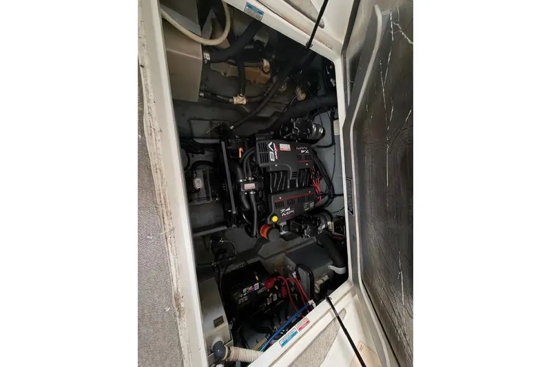 Slide: The Image of Engine compartment of a 1999 Sea Ray 270 Sundancer Special Edition boat. - 24
