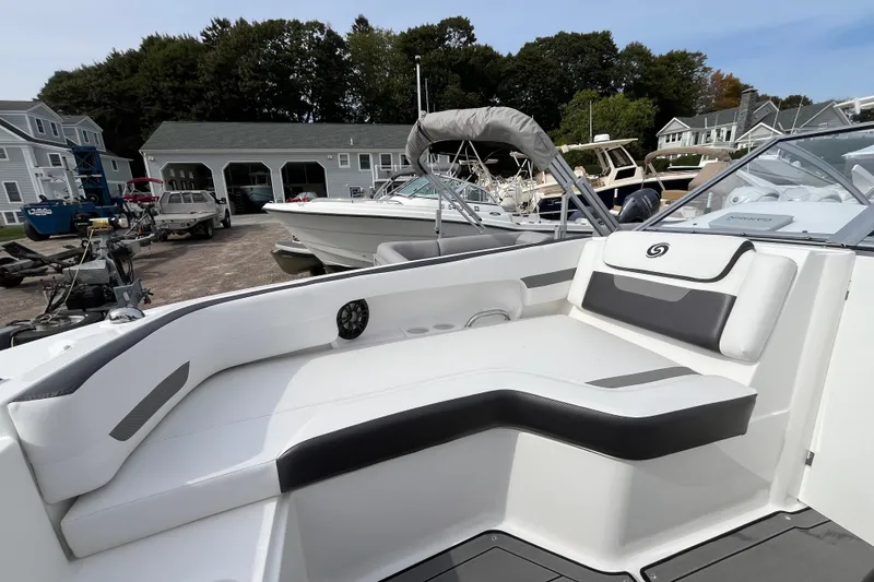 Slide: The Image of 2023 Hurricane SunDeck 235 OB boat interior with sleek seating and modern design. - 26