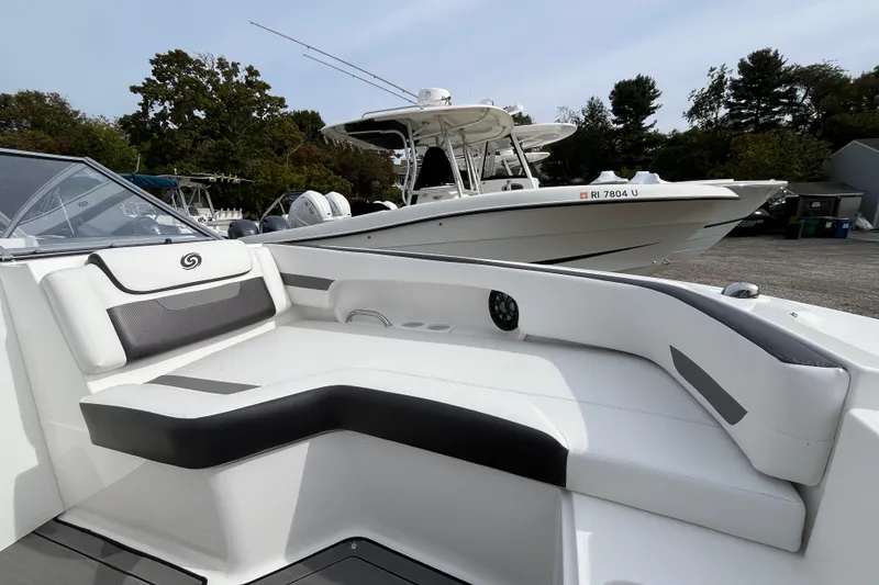 Slide: The Image of 2023 Hurricane SunDeck 235 OB boat with sleek seating and modern design. - 27