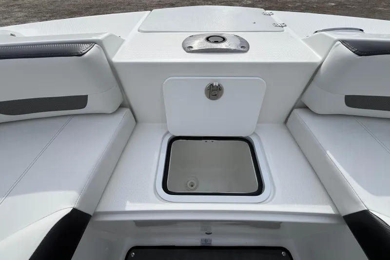 Slide: The Image of 2023 Hurricane SunDeck 235 OB boat interior with storage compartment and seating. - 28