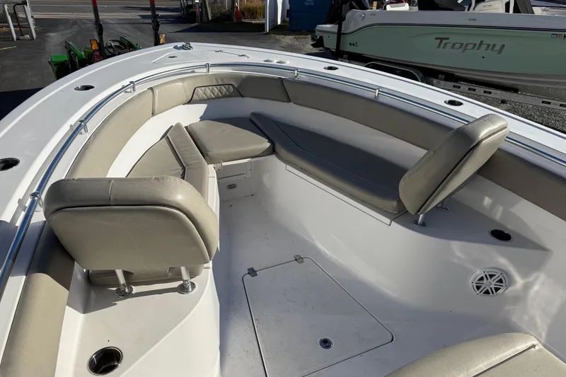 Slide: The Image of 2022 Sportsman Open 262 Center Console boat interior with cushioned seating. - 15