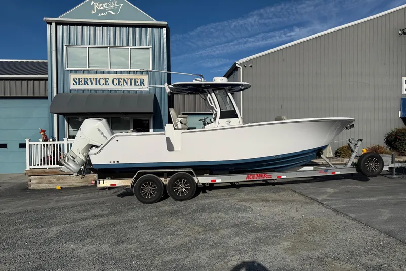 Slide: The Image of 2022 Sportsman Open 262 Center Console boat on trailer at service center. - 20