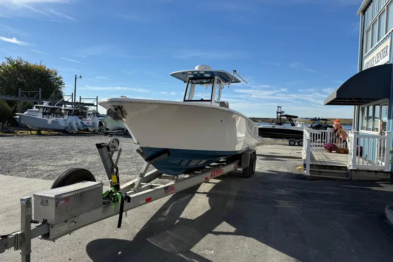 Slide: The Image of 2022 Sportsman Open 262 Center Console boat on trailer at service center. - 21