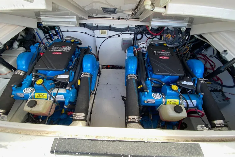 Slide: The Image of Engine compartment of a 2004 Tiara Yachts 3200 Open, featuring a Crusader engine. - 16