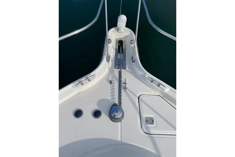 Slide: The Image of Bow of 2004 Tiara Yachts 3200 Open, featuring anchor chain and deck fittings. - 19