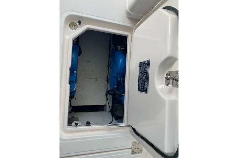 Slide: The Image of 2004 Tiara Yachts 3200 Open engine compartment with blue components visible. - 20