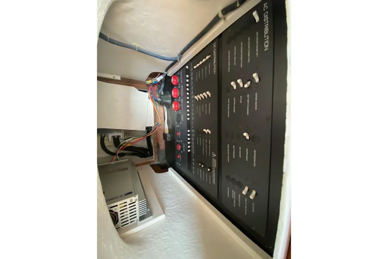 Slide: The Image of Electrical panel of 2004 Tiara Yachts 3200 Open, featuring AC and DC distribution. - 22