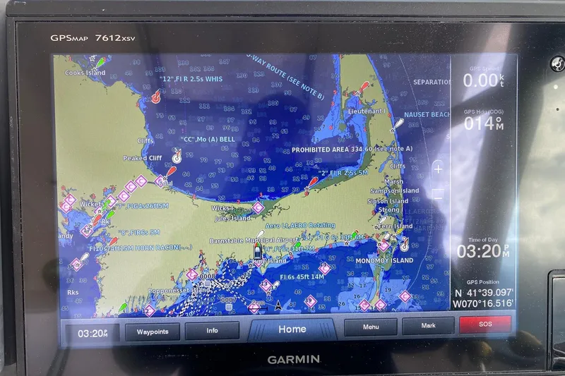 Slide: The Image of Garmin GPS display on 2004 Tiara Yachts 3200 Open, showing nautical map and coordinates. - 23