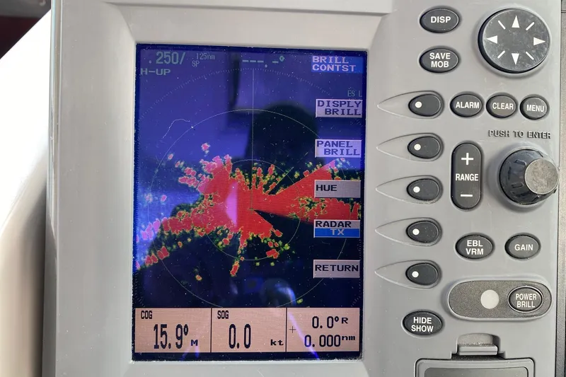 Slide: The Image of Radar display on 2004 Tiara Yachts 3200 Open, showing navigation data and controls. - 24