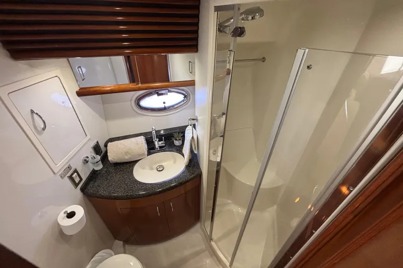 Slide: The Image of Luxurious interior of 2003 Carver 450 Voyager Pilothouse with plush seating and modern helm. - 13