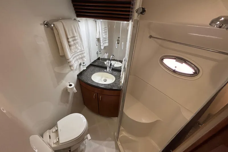 Slide: The Image of Bathroom interior of 2003 Carver 450 Voyager Pilothouse with sink, toilet, and shower. - 21
