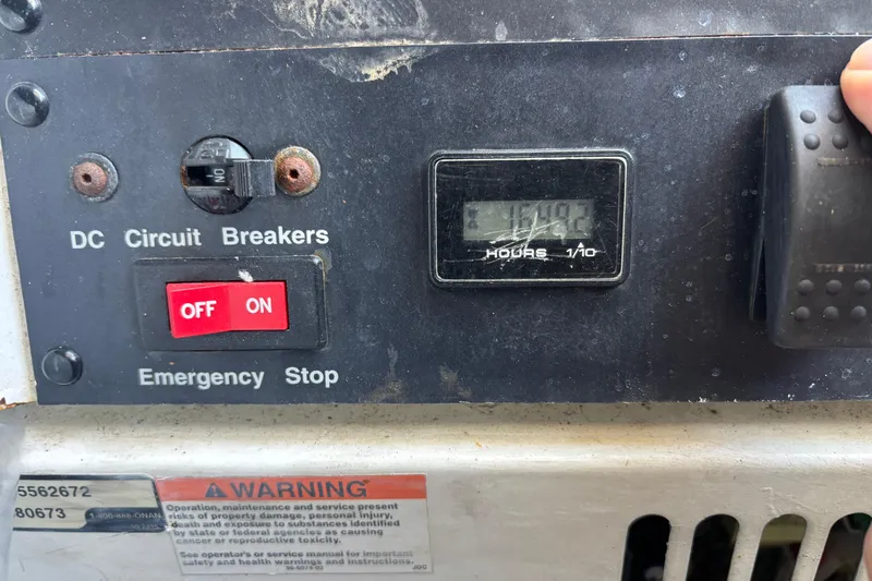 Slide: The Image of 2003 Carver 450 Voyager Pilothouse interior with helm, seating, and wood flooring. - 4