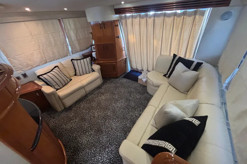 Slide: The Image of Luxurious 2003 Carver 450 Voyager Pilothouse yacht interior with elegant seating and table. - 6
