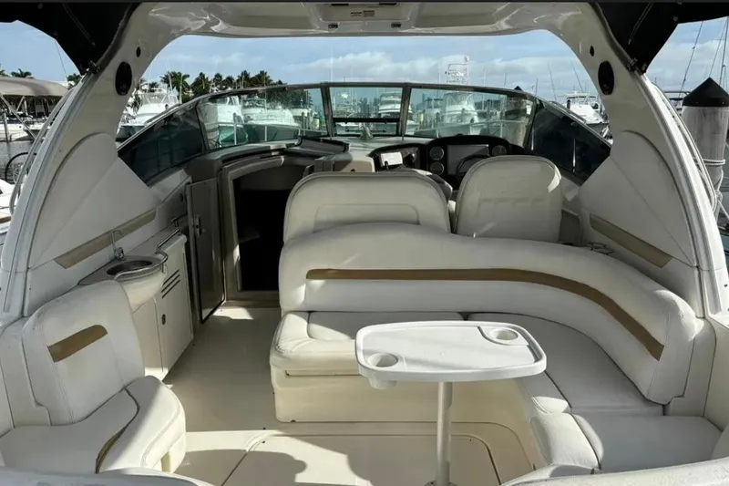 Slide: The Image of Interior view of 2008 Sea Ray 38 Sundancer yacht with white seating and table. - 10