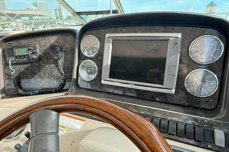 Slide: The Image of Dashboard of 2008 Sea Ray 38 Sundancer with gauges, GPS, and radio equipment. - 14