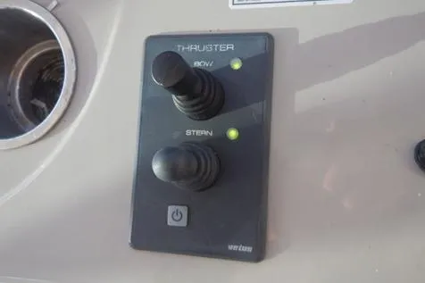 Slide: The Image of Control panel of 2008 Sea Ray 380 Sundancer with bow and stern thruster joysticks. - 15