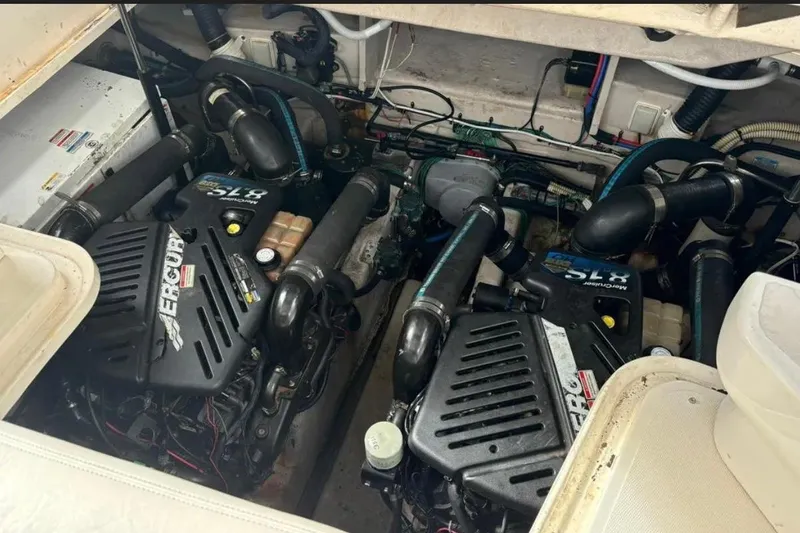 Slide: The Image of Engine compartment of a 2008 Sea Ray 38 Sundancer with twin MerCruiser engines. - 16