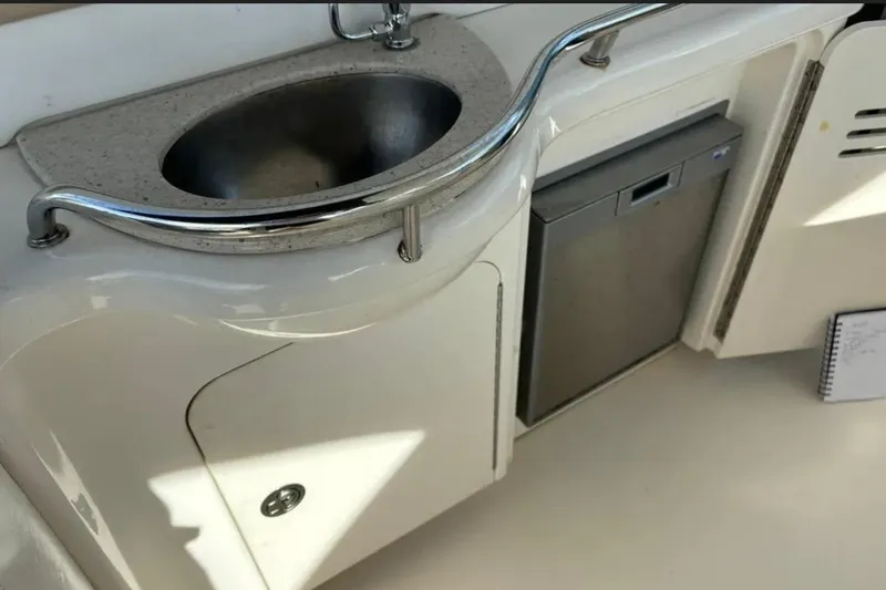 Slide: The Image of 2008 Sea Ray 38 Sundancer yacht kitchenette with sink and mini fridge. - 17