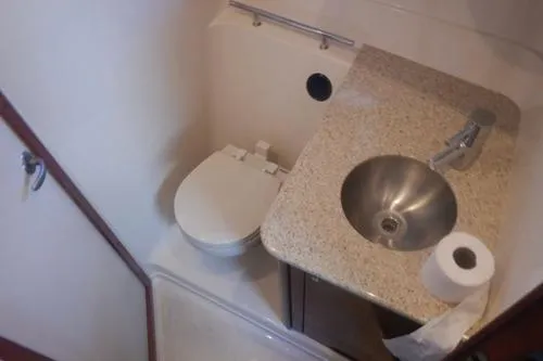 Slide: The Image of 2008 Sea Ray 380 Sundancer bathroom with sink, toilet, and granite countertop. - 22