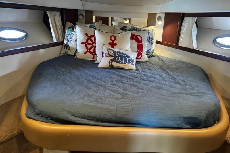 Slide: The Image of Luxurious cabin interior of 2008 Sea Ray 38 Sundancer with nautical-themed pillows. - 24