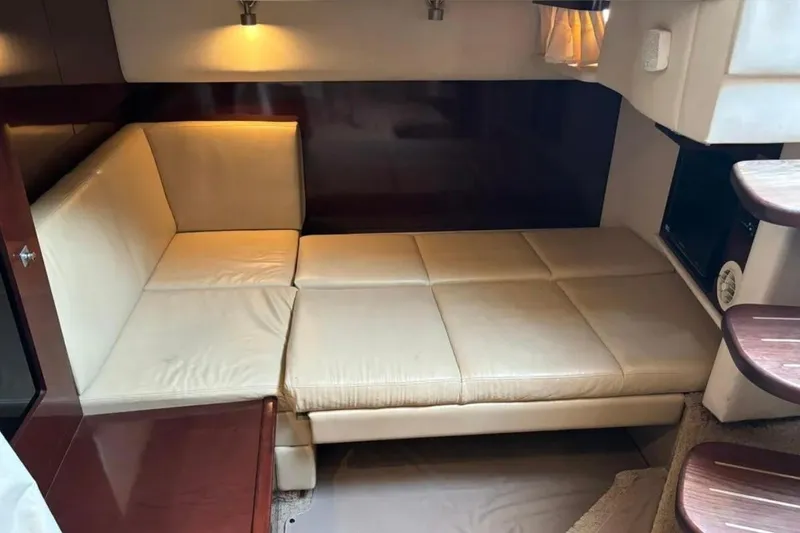 Slide: The Image of Luxurious interior of 2008 Sea Ray 38 Sundancer with beige leather seating. - 27