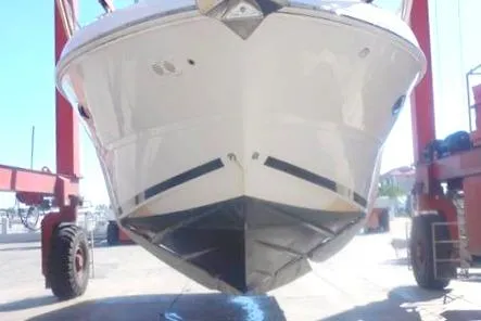 Slide: The Image of 2008 Sea Ray 380 Sundancer boat in dry dock, front view. - 6