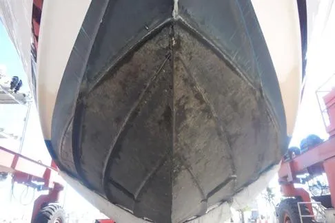 Slide: The Image of 2008 Sea Ray 380 Sundancer boat hull in dry dock, showing underside details. - 7