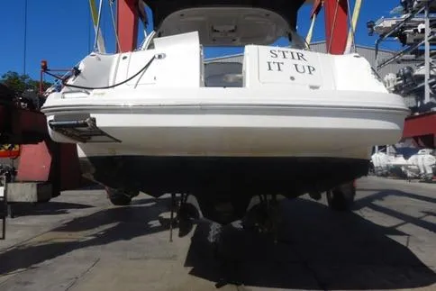 Slide: The Image of 2008 Sea Ray 380 Sundancer boat on lift, rear view, named "Stir It Up". - 9