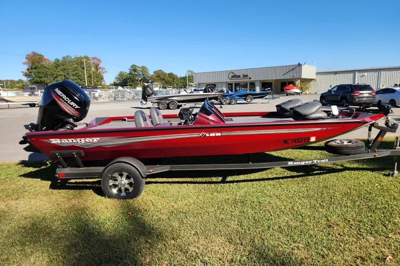 Slide: The Image of 2016 Ranger RT188 boat with Mercury engine on trailer, parked on grass. - 5