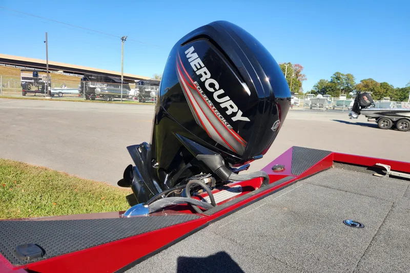 Slide: The Image of 2016 Ranger RT188 boat with Mercury FourStroke outboard motor in a parking area. - 7