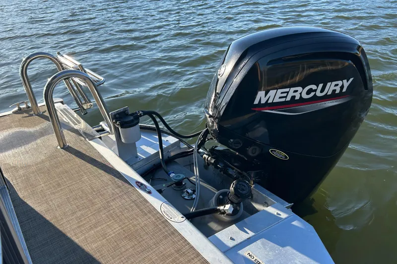 Slide: The Image of 2022 Cypress Cay Seabreeze 232 with Mercury outboard motor on water. - 18