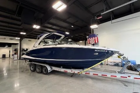 The Image of 2020 Regal 2800 Bowrider boat on trailer in indoor showroom. - 0