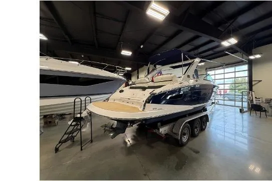 Slide: The Image of 2020 Regal 2800 Bowrider boat on trailer in showroom, rear view. - 1
