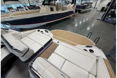 Slide: The Image of 2020 Regal 2800 Bowrider with luxurious seating and spacious deck in showroom. - 21
