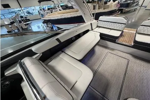 Slide: The Image of 2020 Regal 2800 Bowrider interior with luxurious seating and modern design in showroom. - 8