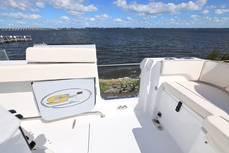Slide: The Image of 2026 Sea Hunt Ultra 275 Coffin Box boat interior with water view and seating. - 10